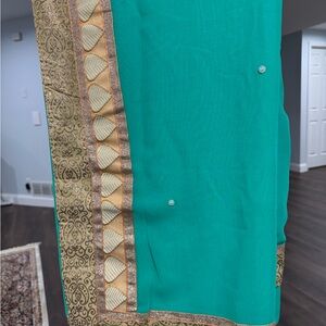 Elegant Teal Sari with Gold Border